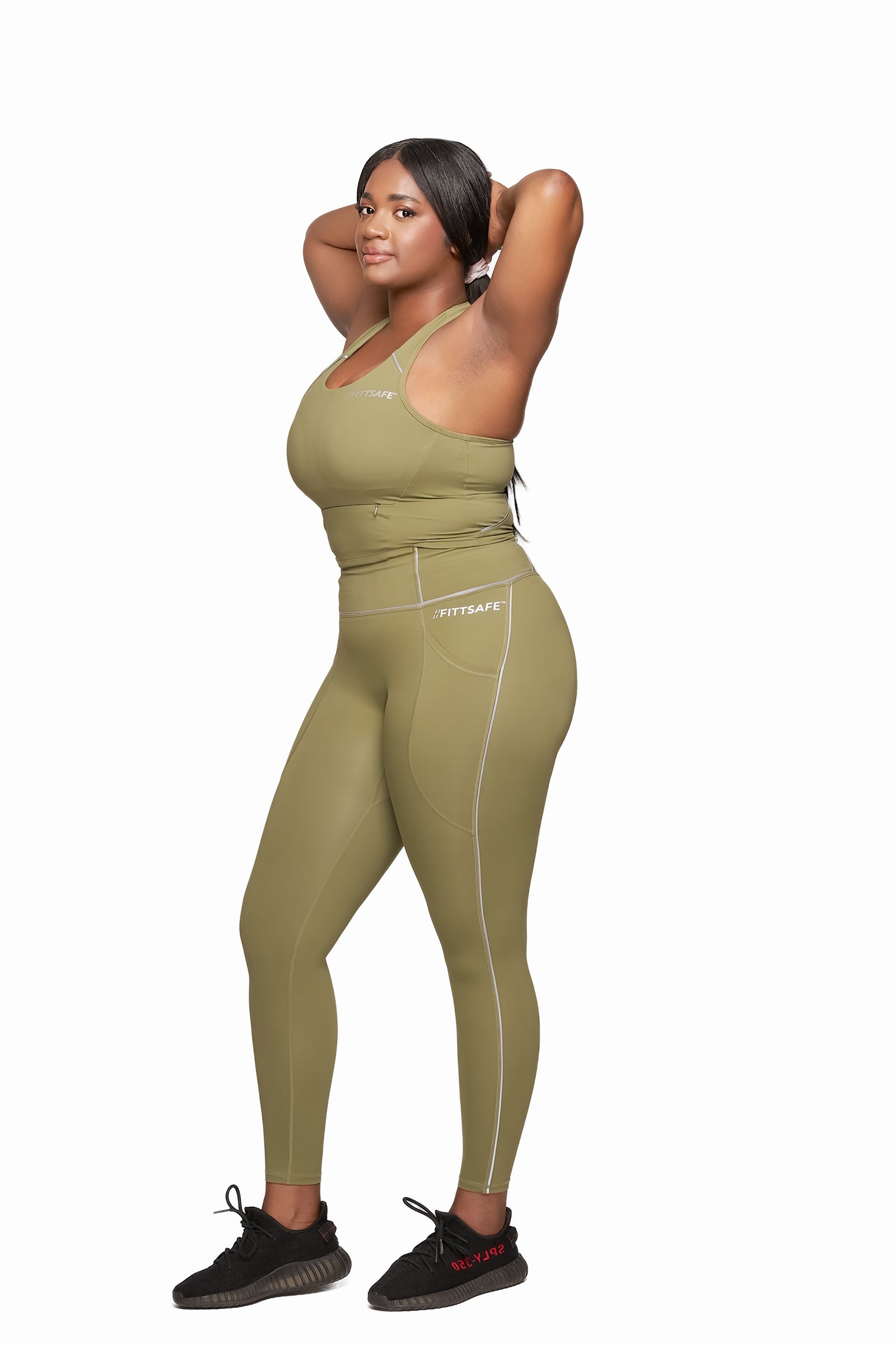 Woman wearing Green Fitt Safe Safety Leggings and Crop top